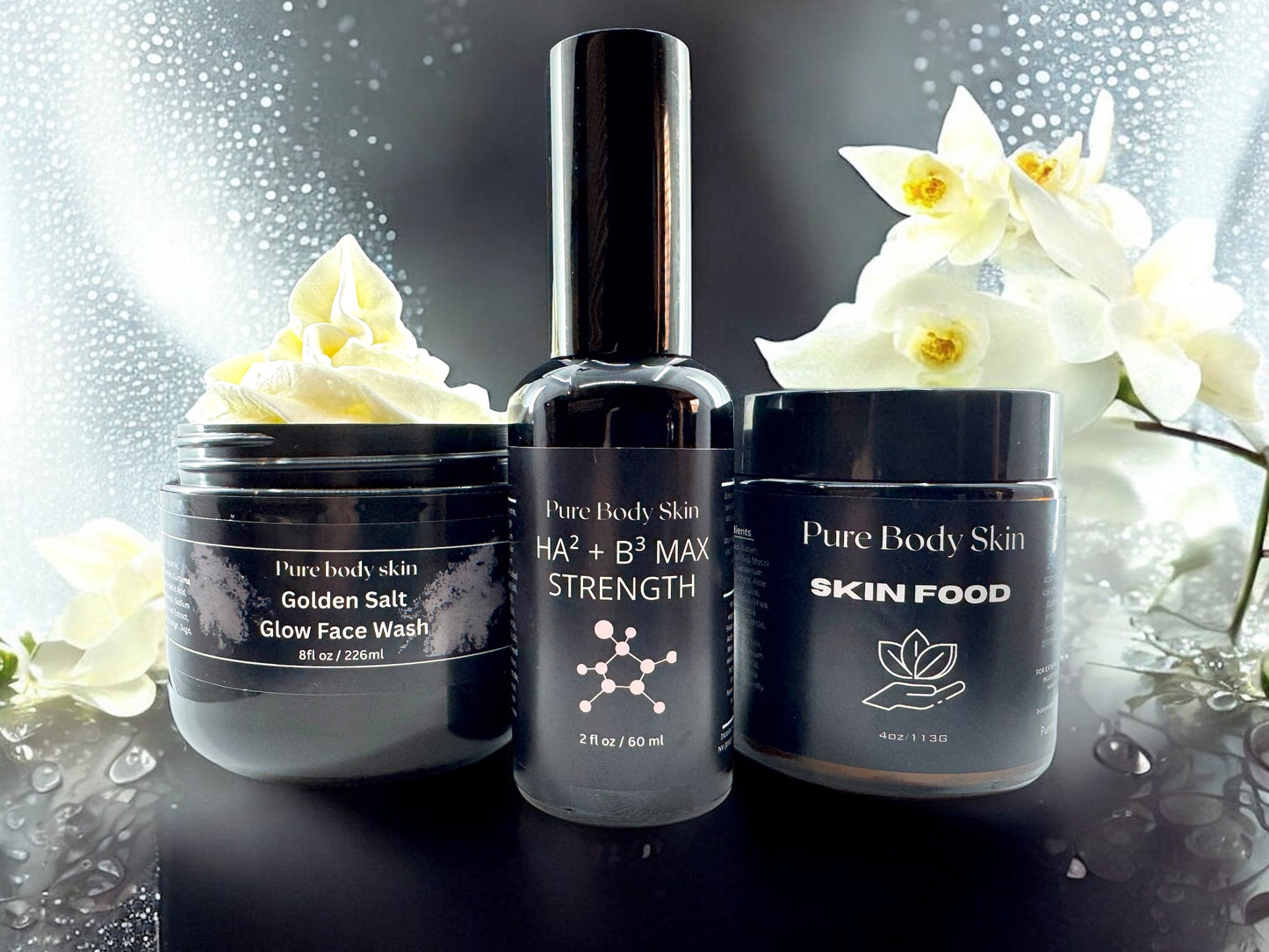 Pure Body Skin 3-step organic skincare bundle featuring Golden Glow Cleanse, HA2 Serum, and Sea Moss Face Cream.